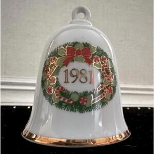 Vintage white china Christmas bell with embossed decorations and gold rim. 1981